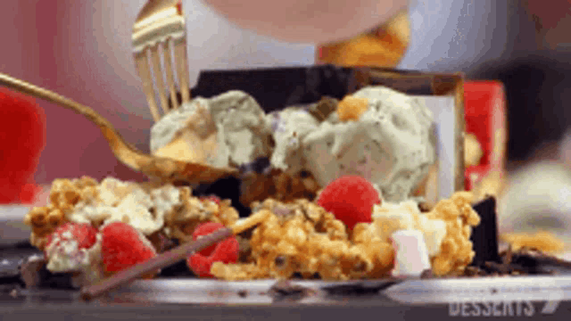 a person is eating a dessert with a fork and the word dessert is on the bottom