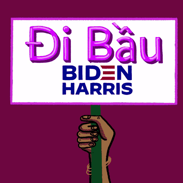 a hand is holding up a sign that says biden harris