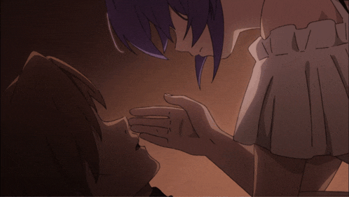 a girl with purple hair is touching a man 's face