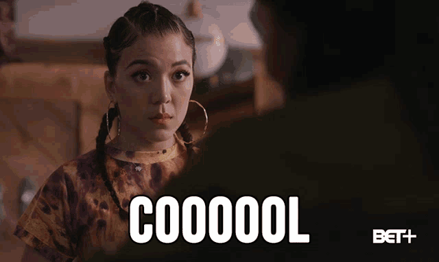 a woman is looking at another woman with the words cooool behind her