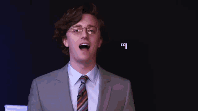 a man in a suit and tie has a quote from brian david gilbert