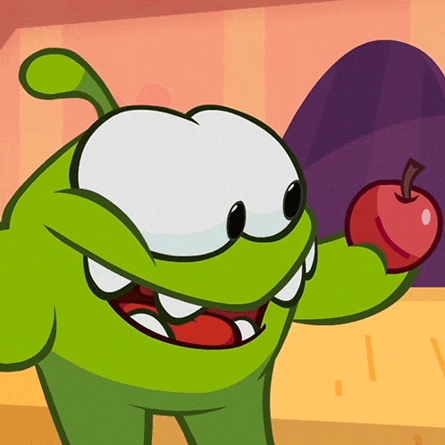 a green cartoon character is holding an apple in his hand