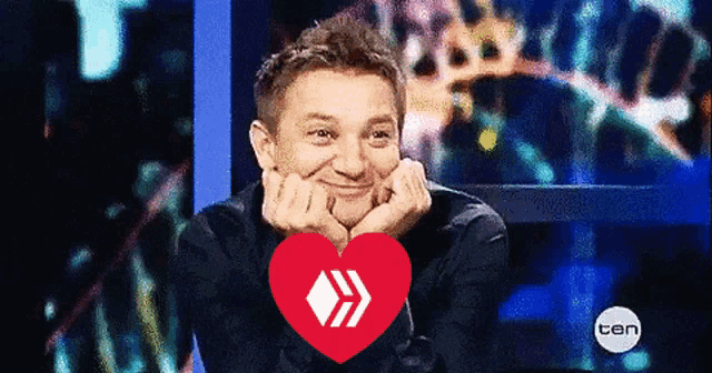 a man with a heart in front of him with the number ten on the bottom right