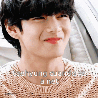 a close up of taehyung 's face with the words taehyung cuando ve a net