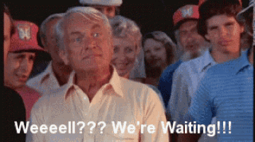a group of people are standing in a line and one of them says " weeeeell "