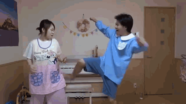 a man in a blue uniform is kicking a woman in an apron that says flying duck