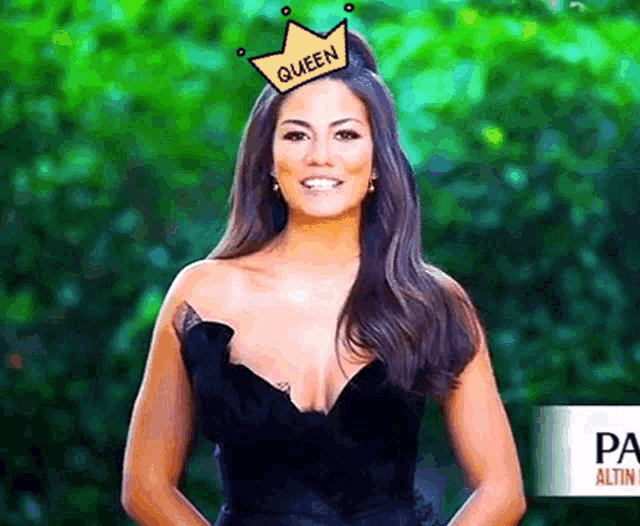 a woman wearing a crown that says queen