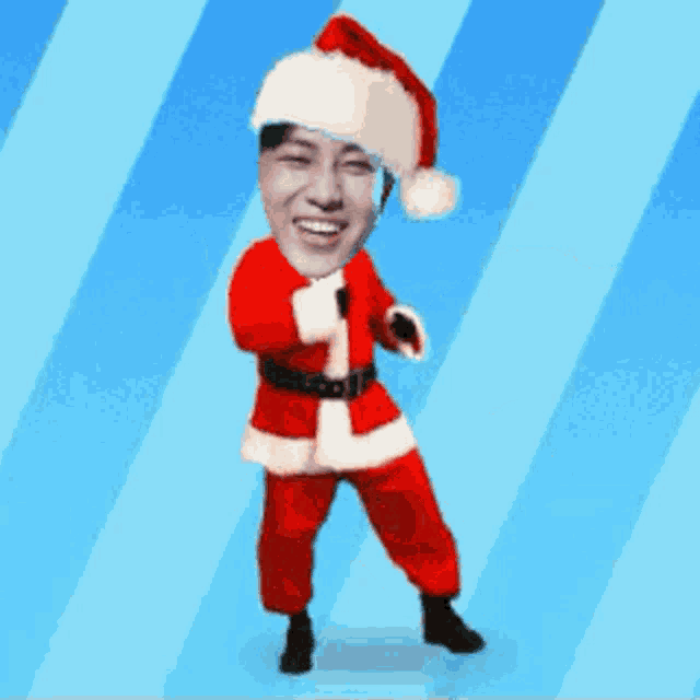 a man in a santa suit is dancing on a blue striped background