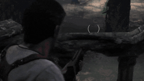 a man is holding a gun in a dark room with a arrow pointing to a tree