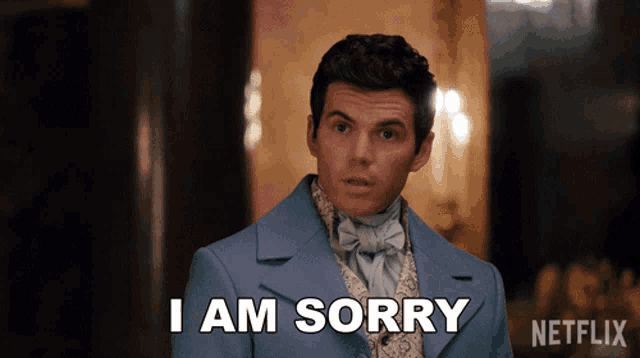 a man in a blue suit says " i am sorry " in front of a netflix logo