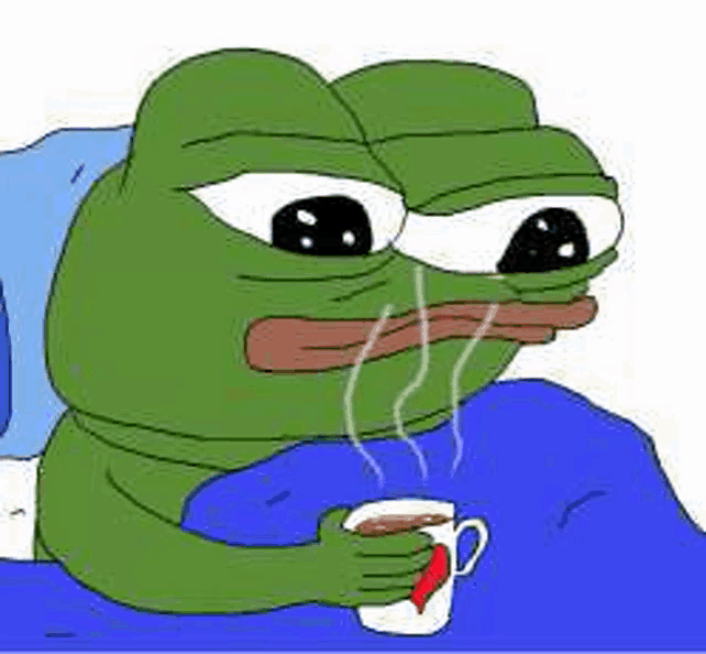 a green frog is sitting on a bed holding a cup of coffee .