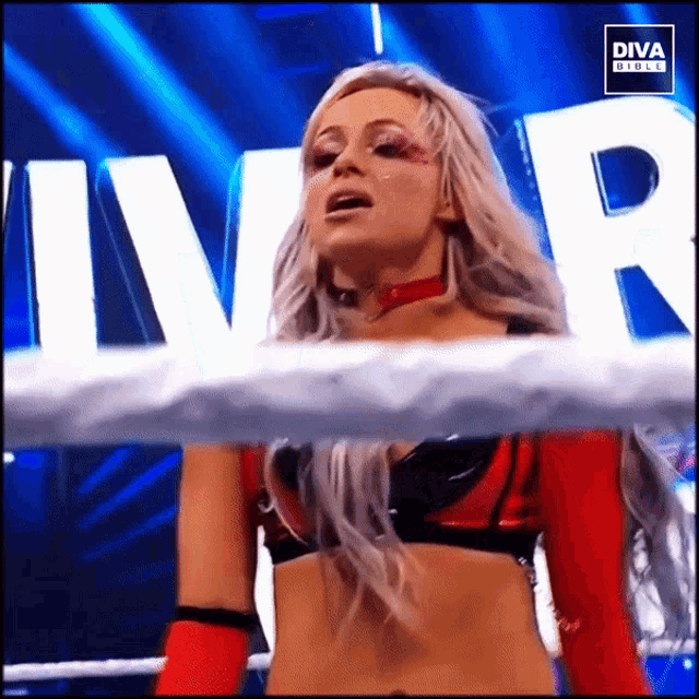 a woman in a wrestling ring with the word diva on the bottom