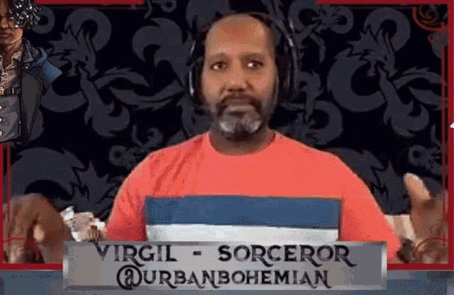 a man wearing headphones and a red shirt is standing in front of a sign that says virgil sorceror urbanbohemian