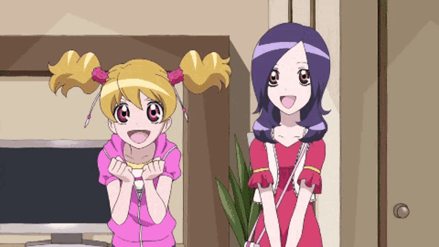 two anime girls are standing next to each other
