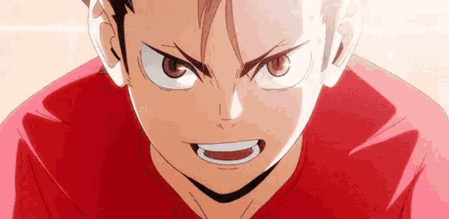 a close up of a person 's face with a very angry look on his face .
