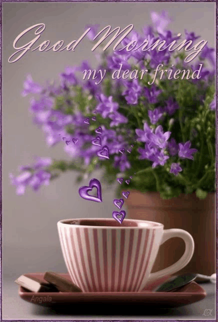 a cup of coffee sits on a saucer with purple flowers in the background