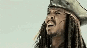jack sparrow from pirates of the caribbean is wearing a pirate hat and dreadlocks .