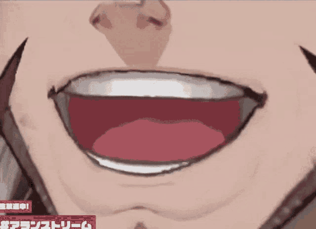 a close up of a person 's mouth with chinese writing on the bottom right corner