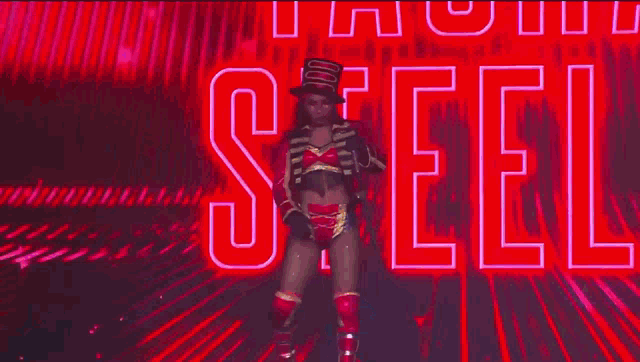 a woman in a circus costume is standing on a stage in a ring .