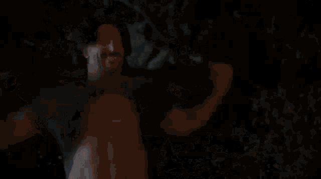 a dog is standing in the dark with its mouth open and looking at the camera .
