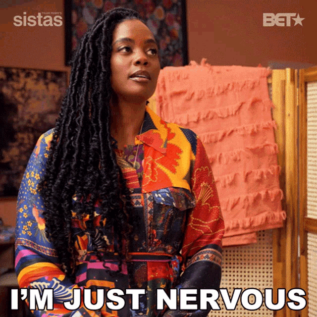 a woman says i 'm just nervous in a colorful shirt