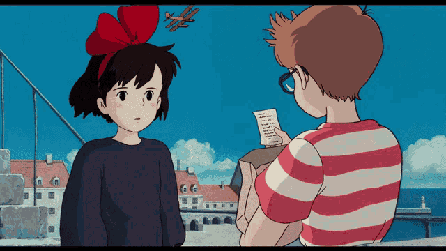a girl with a red bow on her head stands next to a boy with a striped shirt