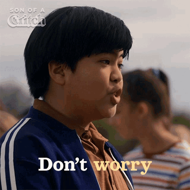 a boy is making a funny face with the words " do n't worry " behind him