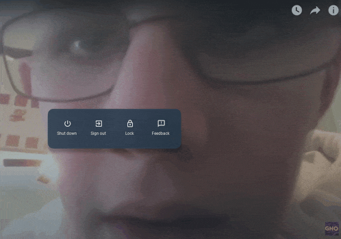 a screen shot of a person 's face with a blue button that says " shut down "