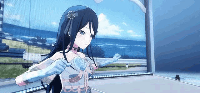a girl in a white dress and blue gloves stands in front of a window overlooking the ocean