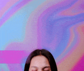 a woman with long hair is making a funny face