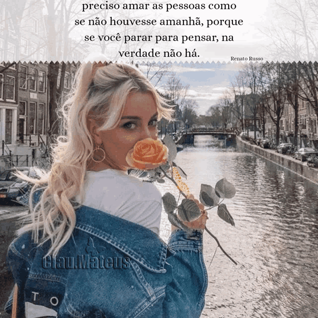a woman in a denim jacket is holding a rose in front of her face