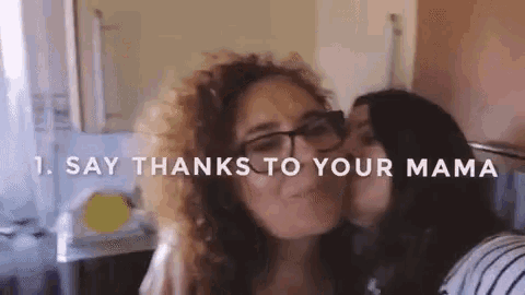 a woman kissing another woman on the cheek with the words " say thanks to your mama "