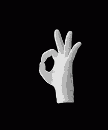 a hand in a white glove is making an ok sign .