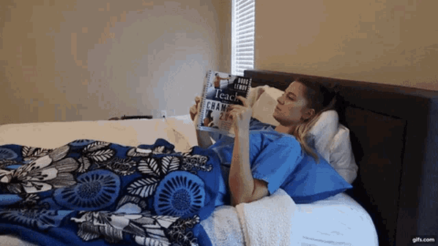a woman is reading a book titled teach champions