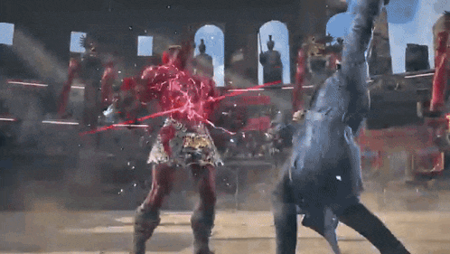 a man and a woman are fighting in a ring and the woman is covered in blood