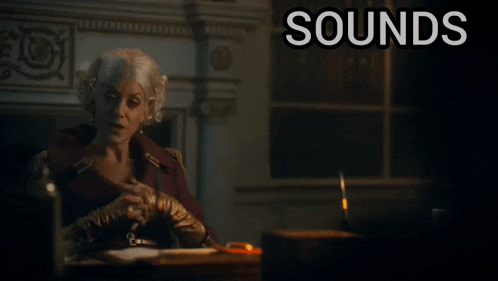 a woman sits at a desk with the words " sounds ridiculous but go on " below her