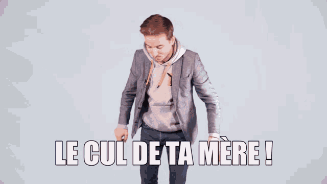 two men are standing next to each other with the words le cul de ta mere written above them