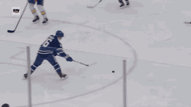 a hockey game is being played in front of a proline sign