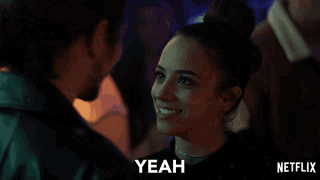 a netflix ad shows a woman smiling and the word yeah on the bottom