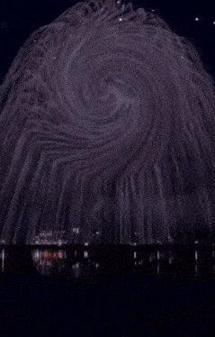 a painting of a swirl with a red white and blue circle in the middle
