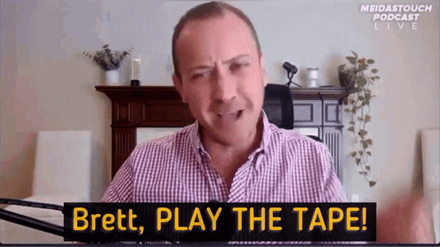 brett play the tape on a screen with a man