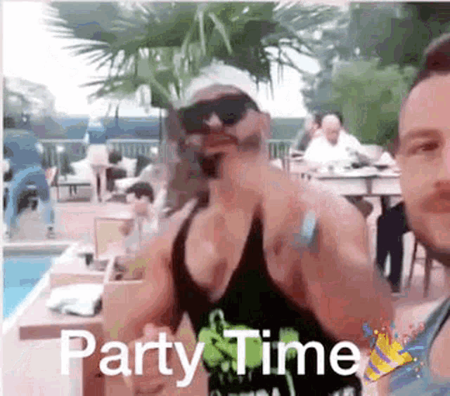 two men are standing next to each other in front of a swimming pool with the words party time written on the bottom .