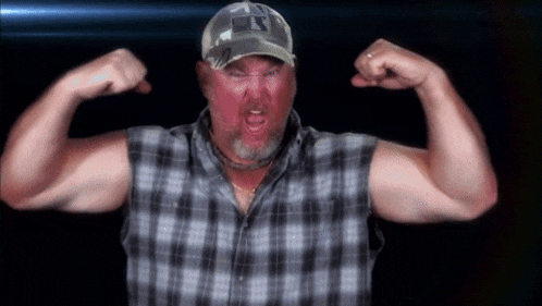 a man in a plaid shirt is flexing his muscles and wearing a hat with the letter s on it