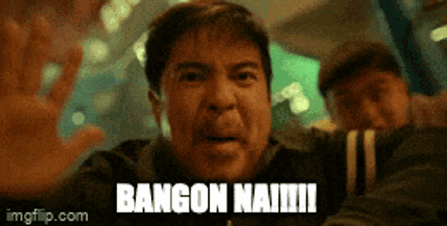 a man is making a funny face with the words bangon na !!! written on his face