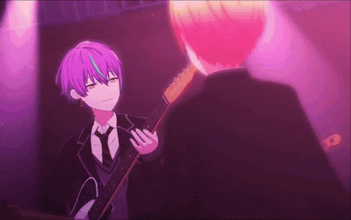 a boy with purple hair is playing a guitar in front of another boy with pink hair .