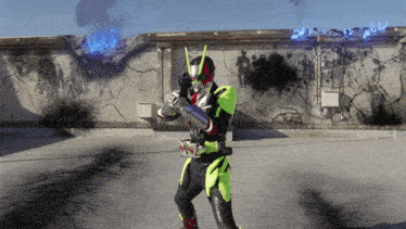a man in a superhero costume holds a gun
