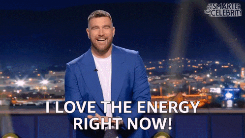 a man in a blue suit says " i love the energy right now ! "