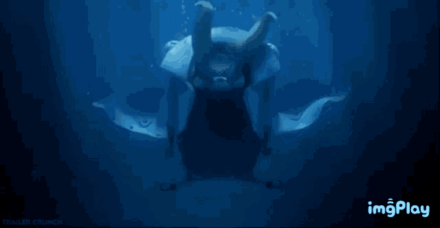 a silhouette of a monster is displayed on a blue background with the words imgplay below it