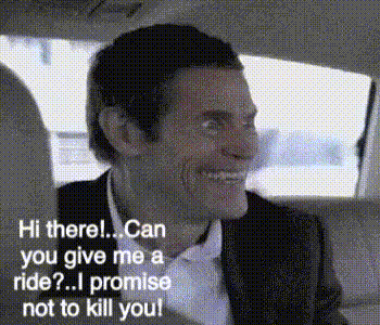 a man in a suit is sitting in the back seat of a car .
