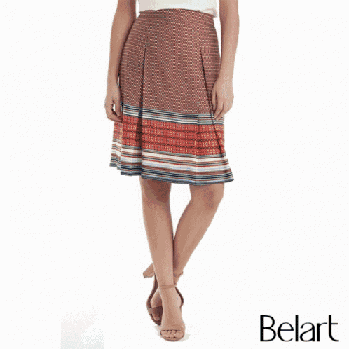 a woman is wearing a green and blue striped skirt and black heels